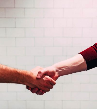 A picture of two people shaking hands, showing the excellent customer service at Veritas